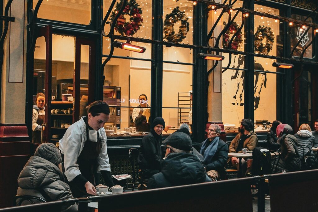 A cafe full of people dining outdoor